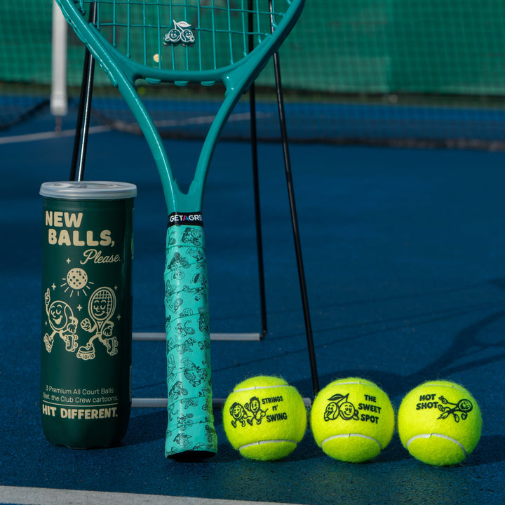 Club Crew balls and racket on court