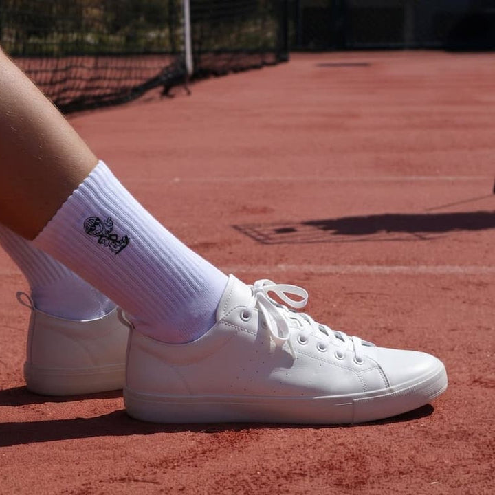 Club Crew socks worn on a clay court